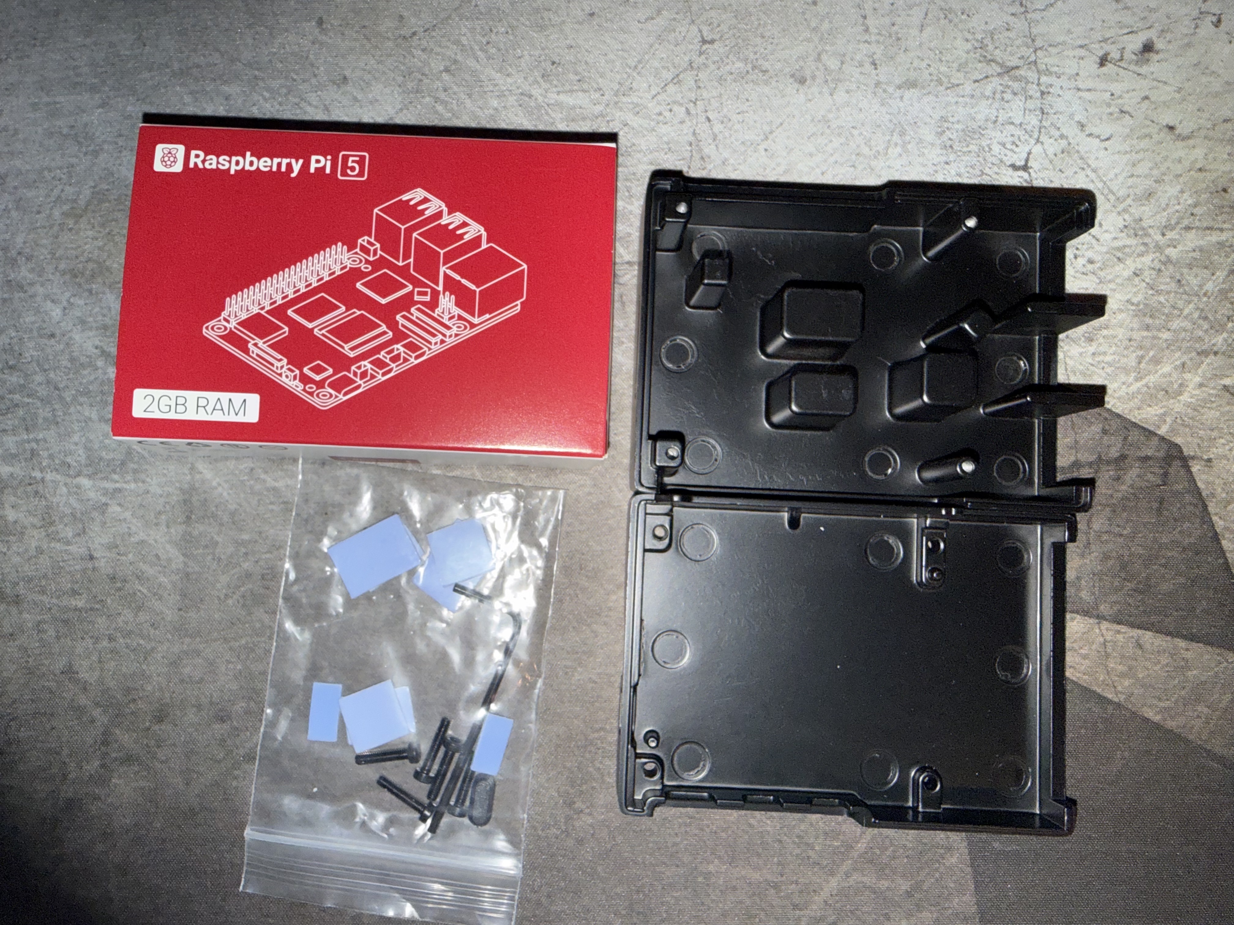 Unboxing: Pi 5 box, case halves, and hardware bag